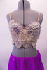 2-piece lyrical costume has a lavender chiffon angled skirt with an attached brief and scattered crystals. The breathtaking haft-bra top is comprised entirely of ivory beaded lace with Swarovski crystals and pearls. Comes with a lavender floral hair accessory. Front