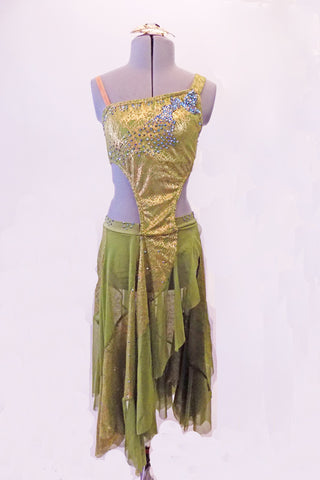 Bohemian inspired gold & olive dress has an asymmetric, single shoulder, gold hashed half-top covered in a cascade of blue-green & AB crystals. The front of the bra top extend down the torso slightly to the left & attached at the crystal-covered waistband. The asymmetric kerchief skirt is random panels of olive & gold. Front