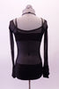 Simple but bold sheer black leotard with sold bottom has a unique halter-like crystalled band originating from the piping of the wide neckline the scoops at the back. A black bra top with crystalled straps sits beneath the sheer leotard. Comes with a crystal hair accessory. Back