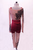 Printed nude mesh full unitard has a black lace pattern in the fabric that cascades at an angle across the torso both front and back. The pattern continues along the long sleeves & legs accented with many scattered crystals. High waisted maroon shorts sit over the unitard and a maroon bra beneath. Back