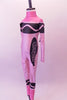 Pink high halter collared, long-sleeved full unitard Has all the markings of a life sized-crayon. Side