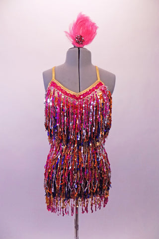 Sassy beaded-fringe flapper style salsa dress features hues of fuchsia, gold, silver and purple sequined beading. The gold banding at the bust extends to become the cross-back straps and double back bands to give the costume a pop of glam. Comes with pink feather and crystal hair accessory. Front