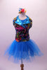 Colourful costume has a turquoise tulle skirt with rainbow sequin waistband, attached to a turquoise short unitard base. The brightly coloured graffiti-style vest has shiny blue lapels with wide rainbow sequin accent. Comes with matching gauntlets and hair accessory. 