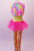 Full unitard has a yellow sequined bodice and colourful patterned legs. The bright pink attached tutu skirt with a large bow adds a bit of fun, while the pastel coloured fur vest completes the whimsy. Comes large daisy flower hair accessory and yellow sequined gauntlets. Back