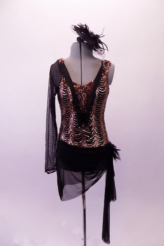 Gold, patterned sequin & black sheer are the base of this beautiful costume. The deep V front has an attached sequined pinch front bandeau inlay. The low V back has double sequined horizontal bands. The single black sheer sleeve & sarong skirt compliment the black bottom. Comes with a black feather hair accessory. Front