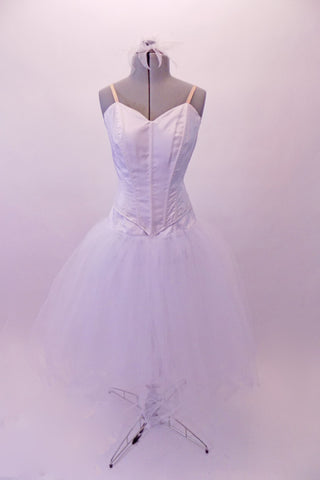 White romantic tutu skirt with attached wide basque lays beneath a peaked-front princess-cut Russian style, boned bodice. The back closes with hook & eye and straps are nude. The costume is simple yet classic & can be decorated further with feathers & crystals. Comes with white hair accessory to fit over a bun. Front
