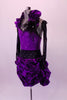 Unique costume has purple sequined bodice. The bodice has an attached gathered halter collar that matches the purple & black velvet damask print, pin-tuck skirt. The wide black crystalled waistband compliments the long black crystalled gloves. Black feathers accent the left shoulder & the matching hair accessory. Left side
