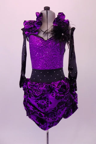 Unique costume has purple sequined bodice. The bodice has an attached gathered halter collar that matches the purple & black velvet damask print, pin-tuck skirt. The wide black crystalled waistband compliments the long black crystalled gloves. Black feathers accent the left shoulder & the matching hair accessory. Front