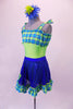Fun lime green-based leotard has blue-green plaid blouson-style bust area that ties at the shoulders. The matching blue sequined pull-on skirt has plaid ruffle edge and faux decorator pockets. Comes with a floral hair accessory. Left side