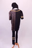 Black pant with gold piping is accompanied by matching black and gold piped, front snap, jersey style shirt. The right half of the shirt is black while the left has a gold crackle finish. Comes with a black knit toque and gold high-top running shoes. Back