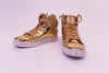 Gold high top shoes