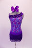 Purple sequined camisole short-tard has angled ruffle accent at front bustline. The short accent skirt is made of double-layered purple fringe for a sassy effect. Comes with a large bow hair accessory. Front