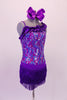 Purple sequined camisole short-tard has angled ruffle accent at front bustline. The short accent skirt is made of double-layered purple fringe for a sassy effect. Comes with a large bow hair accessory. Right side