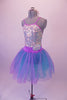 Beautiful romantic tutu dress has silver sequined camisole bodice with lilac piping, A blue and lilac crystal tulle skirt is attached at the waist by a lilac waistband with jeweled accents. Comes with a jewelled headband. Side