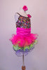 Rainbow sequined camisole tank dress has black cross straps. The curly ruffled skirt is layers of bright pink, blue and green with a black edge. There is an organza rose at the left bust. Comes with a pink floral hair accessory. Right side