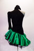 Dress has a black torso with a single shoulder and long left pouffe sleeve, attached to a neckband collar. The entire torso is covered with SS20 black crystals and is angled down towards the right hip. The emerald satin skirt had layered black ruffled petticoat for added volume. Comes with a hair accessory. Back