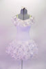 Warm-white tutu dress has pretty silver sequined overlay with 3-D pink flower petals. The same fabric creates the ruffle that lines the bodice along the drop shoulder. Nude straps hold the dress in place. Comes with a pale pink jewelled hair accessory. Front