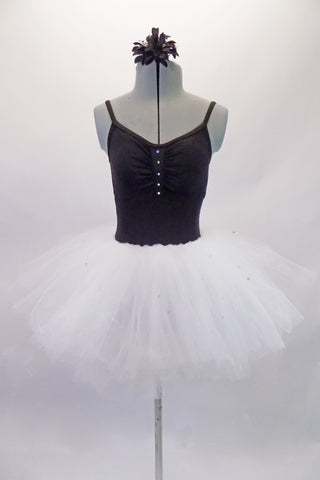 Black camisole leotard has gathered front accented with crystals. The pull-on full white tutu skirt is adorned with scattered crystals and accompanies the black leotard Comes with a hair accessory. Front