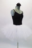 Black camisole leotard has gathered front accented with crystals. The pull-on full white tutu skirt is adorned with scattered crystals and accompanies the black leotard Comes with a hair accessory. Side