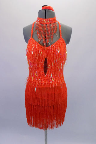 Bright orange, tie-up halter style dress covered entirely in beaded dangle sequins and fringe. The top is a sweetheart neckline with built-in cups and an open back bottom/skirt portion is comprised entirely of layers of orange fringe. Comes with orange sequined necklace accessory and separate orange brief. Front