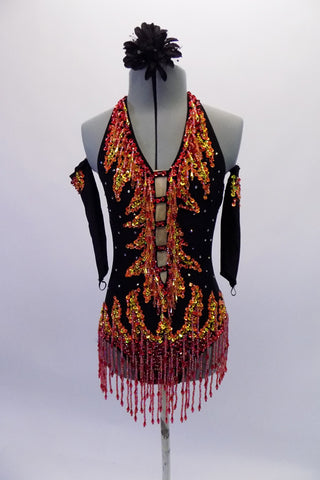 Black halter leotard covered with sequins & crystals. The front centre has a nude mesh ladder cut & neckline, bottom & hips are adorned with dangling beads, surrounded by sequins all in shades of orange, gold & red. The leotard is also scattered with 20SS AB crystals. Comes with matching gauntlets & hair accessory. Front