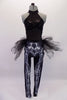 Black halter neck full leotard has sequined bust with a piping design below the neck. The attached pant section as an X-ray effect print showing bones interlaced with robotic parts. The hips have an attached black tulle back bustle. Front