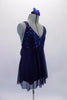 Navy blue empire cut baby-doll dress had a sequined bust and flowing knee-length chiffon shirt. The dress has an attached brief and comes with a floral hair accessory. Side