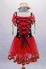 Red and black romantic ballet tutu dress, has a velvet bodice. The ribbon laced front has white rose accents. The red tulle pouffe cap sleeves are joined to the camisole straps. Red satin ribbon and green ricrac line the bottom edge of the skirt. Comes with matching miniature straw hat accessory. Front