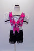 Bright pink tartan print half-top has white eyelet pouffe sleeves and white sequined centre accented with black ruffle. The accompanying booty short is fully fringed with crystal accents along the hip.  Comes with fringed black sequined pull-on boots/socks with elastic reinforced bottom. Front
