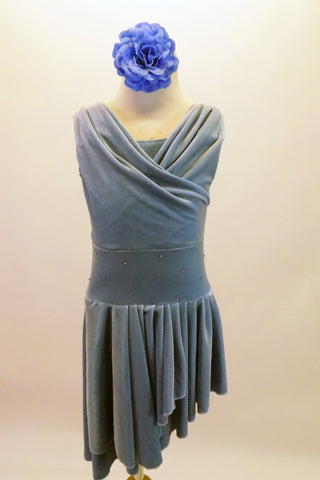 Cornflower blue velvet dress has a draping cross-over front to accentuate the cross front, high-low side skirt. The skirt is full and moves beautifully on stage. The wide waistband is covered with scattered crystals. Comes with separate matching briefs and headband. Front