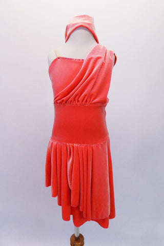 Salmon coloured velvet high-low dress has clear shoulder straps and a gathered front drape that extends just over the left bust to the shoulder. Crystals accent the bustline for a little sparkle. Comes with separate matching briefs and headband. Front