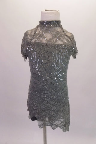 Grey camisole leotard sits beneath a grey sequined lace, mandarin collared cover dress with lace-up back. Though simple and sparkly, the costume has a forlorn style. Comes with a hair accessory. Front
