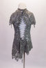 Grey camisole leotard sits beneath a grey sequined lace, mandarin collared cover dress with lace-up back. Though simple and sparkly, the costume has a forlorn style. Comes with a hair accessory. Back