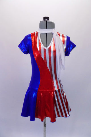 American flag-themed dress has peek-a-boo front and large keyhole back. The torso and skirt are vertical sections of blue red and red-white stipes with cap sleeves and a white sheer attached neck scarf accent. The costume has red crystals along front, sleeves and back. Comes with a hair accessory. Front