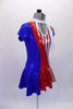 American flag-themed dress has peek-a-boo front and large keyhole back. The torso and skirt are vertical sections of blue red and red-white stipes with cap sleeves and a white sheer attached neck scarf accent. The costume has red crystals along front, sleeves and back. Comes with a hair accessory. Right side