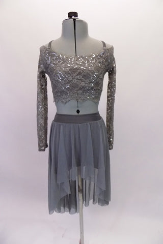 Grey camisole half-top sits beneath a grey sequined lace, long-sleeved half cover. The matching grey sheer mesh high-low skirt completes the look. Though simple and sparkly, the costume has a forlorn style. Comes with a hair accessory. Front