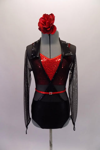 Sheer black, cross front, mesh long-sleeved leotard has a solid bottom and collar with crystals. A red camisole half top sits beneath the leotard for a colour pop. Comes with red crystal accent belt and hair accessory. Front