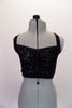 black sequined half top that goes underneath the blazer. Front view