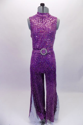 Fully sequined purple unitard with deep open back and tank-style front. The attached belt has a large crystal belt buckle for that extra bling. The pant legs are wide bottom for that 70s feel and have a glittery silver side insert (inseam 30”). Comes with a purple hair accessory. Front
