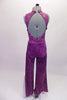 Fully sequined purple unitard with deep open back and tank-style front. The attached belt has a large crystal belt buckle for that extra bling. The pant legs are wide bottom for that 70s feel and have a glittery silver side insert (inseam 30”). Comes with a purple hair accessory. Back