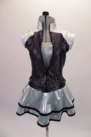 Three-piece, silver costume is comprised of a camisole leotard with a matching short double ruffled skirt with black piping. The accompanying zip front vest is a sequin print black with silver quilted shoulders. Comes with a hair accessory. Front