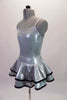 Three-piece, silver costume is comprised of a camisole leotard with a matching short double ruffled skirt with black piping. The accompanying zip front vest is a sequin print black with silver quilted shoulders. Comes with a hair accessory. Side no vest