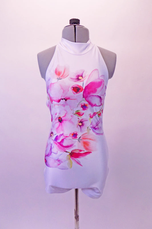 Gorgeous white short unitard with open back is covered with magnolia flowers in shades of pinks, purples and coral. Front