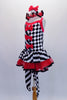 Harlequin themed tutu dress is an alternating pattern of black-white stripes & black-white checks. A red tulle skirt with black satin ribbon makes the skirt & matches the ruffled collar. Three red bows accent the bodice. Comes with red hair bow & stirrup socks. Side