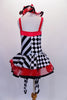 Harlequin themed tutu dress is an alternating pattern of black-white stripes & black-white checks. A red tulle skirt with black satin ribbon makes the skirt & matches the ruffled collar. Three red bows accent the bodice. Comes with red hair bow & stirrup socks. Back