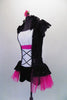 Peasant style costume has a white gathered bust accented with crystals above a white bodice with faux lace inlay. Pink & black lace on sides & back with cap sleeves &  Elizabethan ruffled neck. The peplum bustle over the black short is black lace & pink tricot. Comes with a floral hair accessory. Side