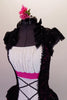 Peasant style costume has a white gathered bust accented with crystals above a white bodice with faux lace inlay. Pink & black lace on sides & back with cap sleeves &  Elizabethan ruffled neck. The peplum bustle over the black short is black lace & pink tricot. Comes with a floral hair accessory. Front Zoomed