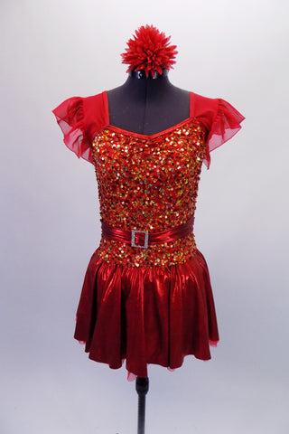 Red dress with a metallic skirt and ruffled ap sleeves has a fully sequined gold and red bodice that shimmers beautifully on stage. The jewelled belt adds extra pop. Comes with a red floral hair accessory. Front