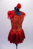 Red dress with a metallic skirt and ruffled ap sleeves has a fully sequined gold and red bodice that shimmers beautifully on stage. The jewelled belt adds extra pop. Comes with a red floral hair accessory. Side