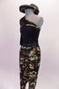 One shoulder top with mesh accents at the waist. The right shoulder is a cold shoulder single mesh sleeve. Camouflage print harem pants accompany the top which also has some camouflage accents. Comes with a camouflage newsboy hat. Side